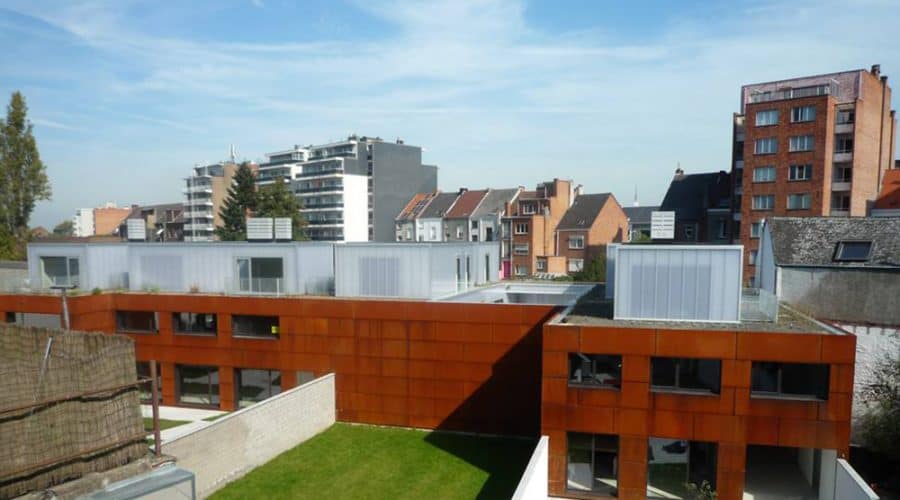 Mechelen Appartementencomplex BUSO gevelbekleding panelen met ramen woonhuizen